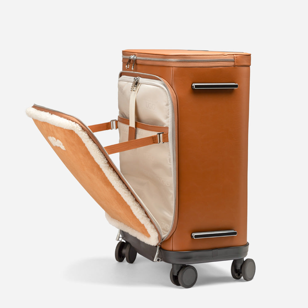 Brown suitcase with open front compartment on a white background