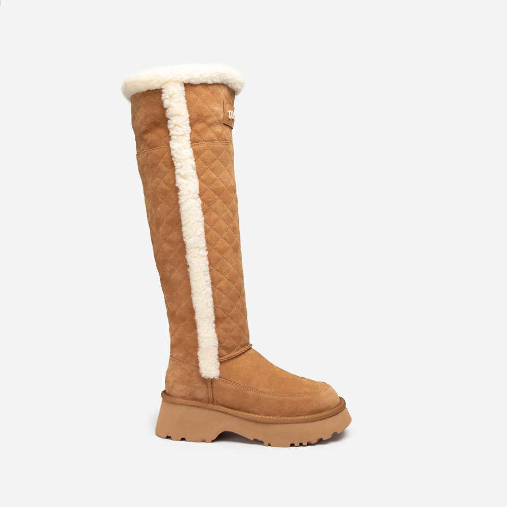Tan knee-high UGG boot with white fur lining on a white background