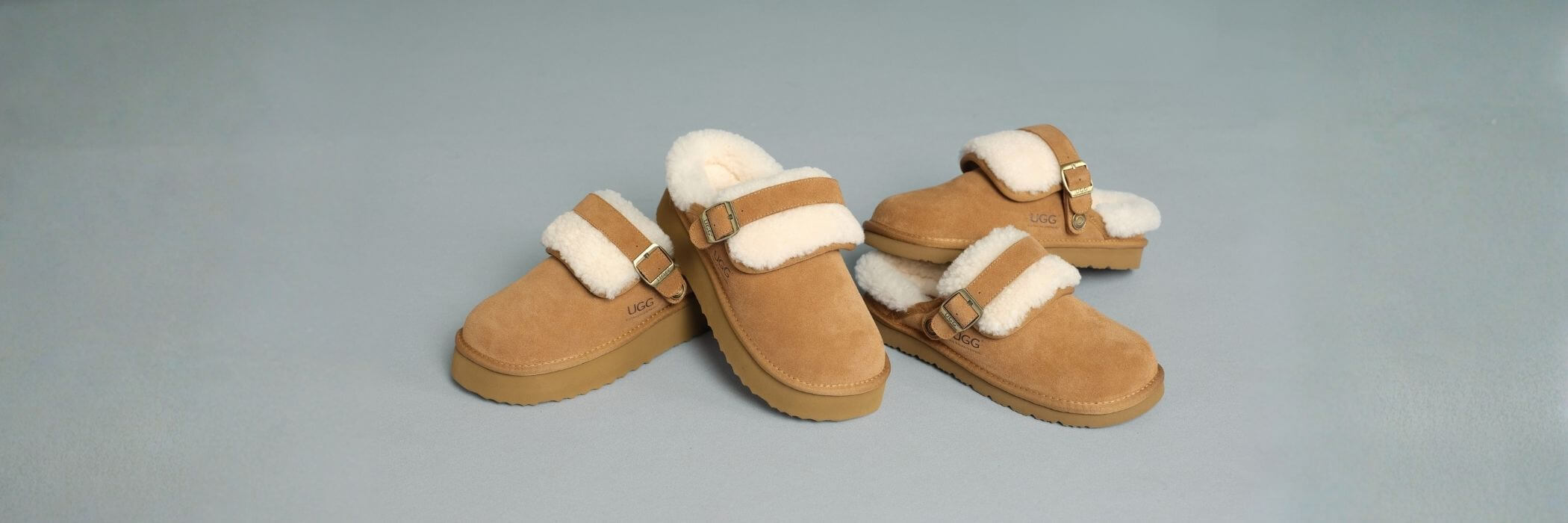 Chestnut UGG slippers with adjustable strap and fluffy sheepskin lining from premium Australian brands displayed on a neutral backdrop | Shop UGG Slippers with Straps Online | PEROZ