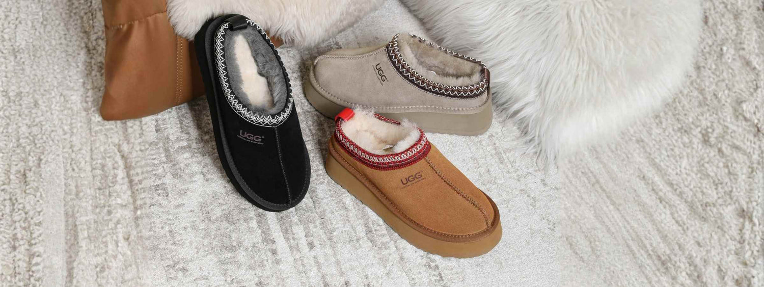 UGG Ankle Slippers Collection - Cozy Tasman Slippers in Black, Chestnut, and Grey with Signature Shearling Lining and Platform Soles on Faux Fur Rug | Shop Authentic UGG Australia Ankle Boots &amp; Slippers Online at PEROZ Australia