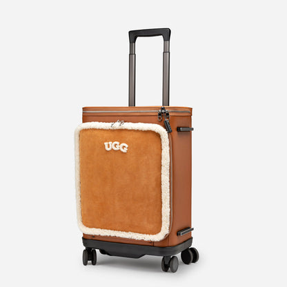 Brown suitcase with UGG logo on a white background