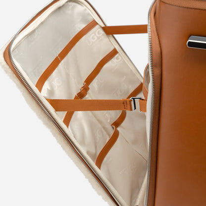 Brown suitcase with open compartment showing beige interior