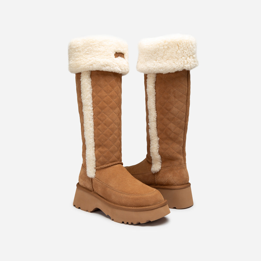 Pair of tan knee-high UGG boots with white fur lining on a white background