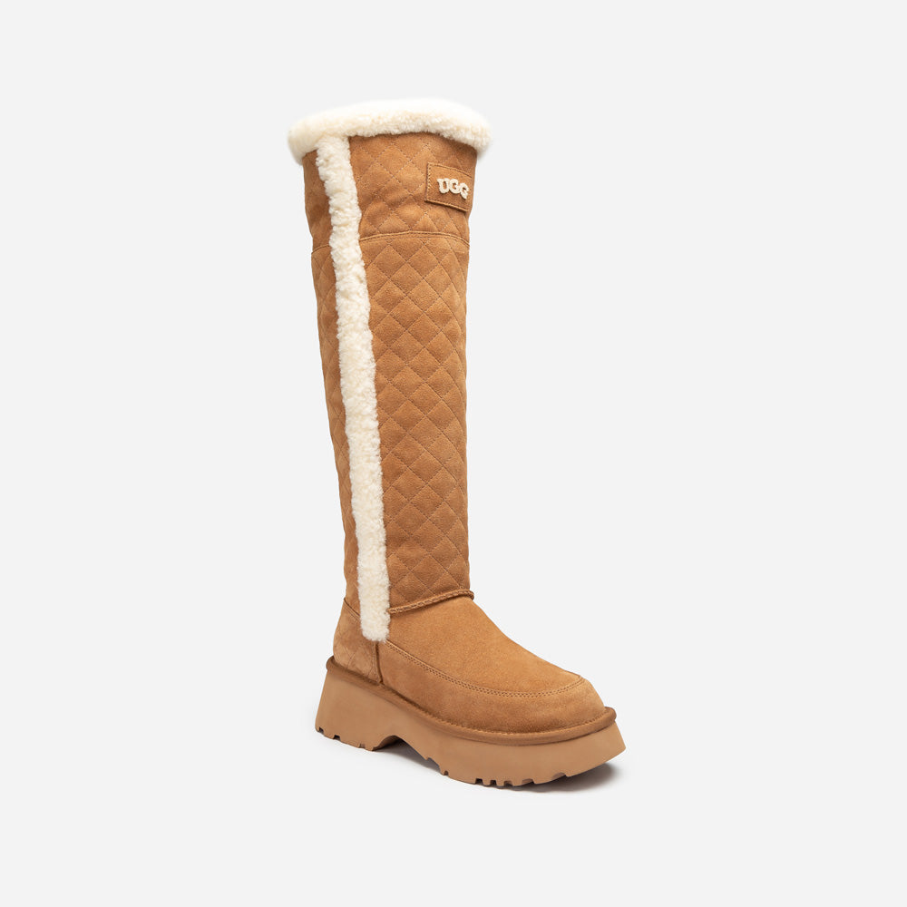 Tan quilted knee-high UGG boot with white fur lining on a white background